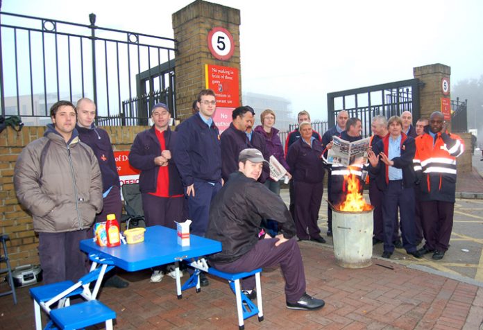 Postal  workers at Poplar, picketing on October 11th as part of the national strike action that was called off by the national leadership in favour of weeks of secret talks