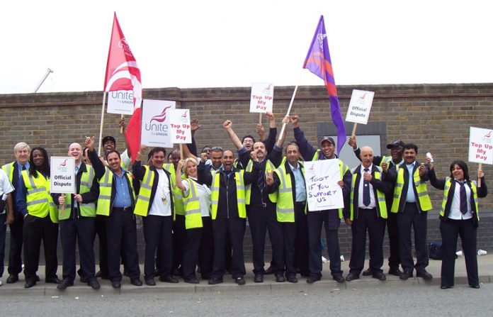Defiant striking busworkers outside the Lea  Interchange garage in north London yesterday