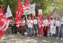 Members of Unite assemble for a demonstration in central London during national strike action by local government workers in July