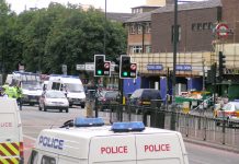 Police surround Stockwell tube station after armed officers brutally executed Jean Charles de Menezes on July 22, 2005