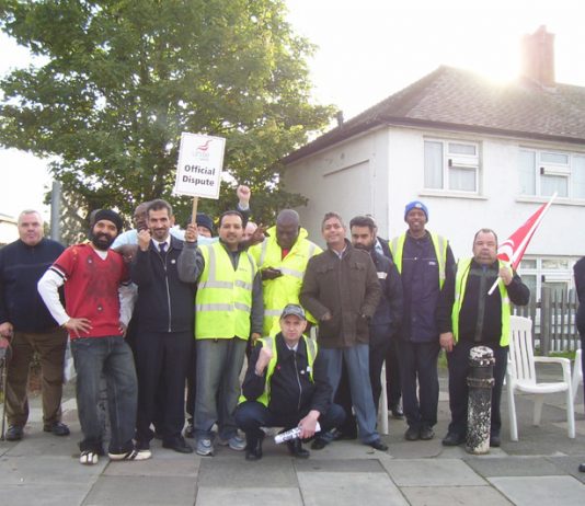 Busworkers on the picket line yesterday at greenford garage – determined to fight for the same pay for all busworkers