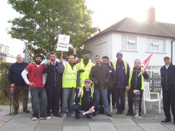 Busworkers on the picket line yesterday at greenford garage – determined to fight for the same pay for all busworkers