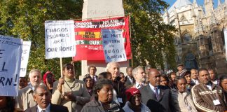 Journalist JOHN PILGER (centre) joins HENGRIDE PERMAL (left of centre) and OLIVIER BANCOULT (third from the right, front row) in a demonstration against the House of Lords ruling yesterday