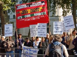 Angry Chagossians with their banner demanding return to Diego Garcia as they picket Downing Street