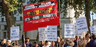 Angry Chagossians with their banner demanding return to Diego Garcia as they picket Downing Street