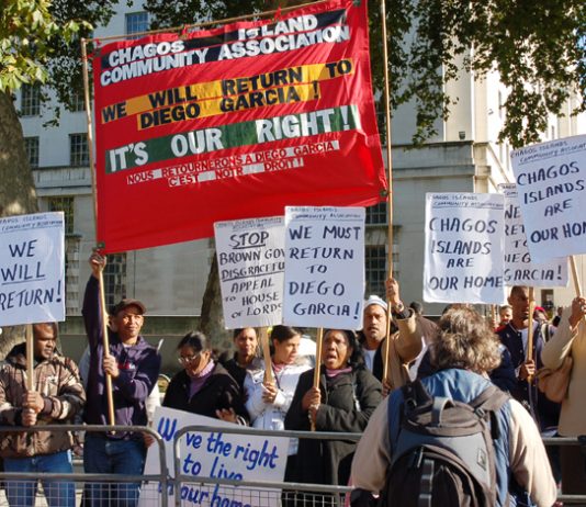 Angry Chagossians with their banner demanding return to Diego Garcia as they picket Downing Street