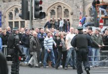 Loyalists opposed to the Sinn Féin protest parade against the British army in Belfast
