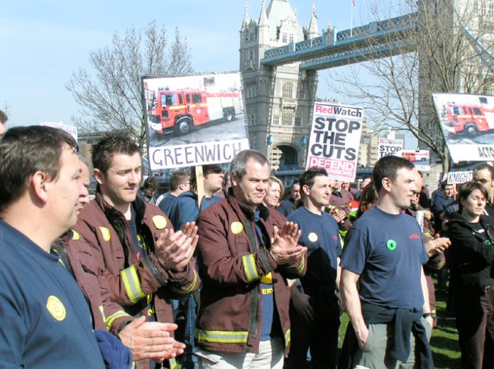 Firefighters demonstrating against cuts to the fire service in London. Their union warns that the cuts are endangering lives
