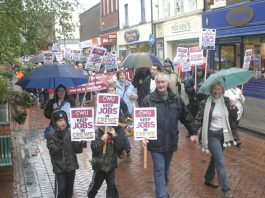 Postal workers and their families  marching through Crewe demanding that the Mail Centre be kept open