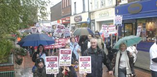 Postal workers and their families  marching through Crewe demanding that the Mail Centre be kept open