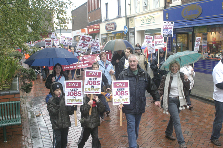 Postal workers and their families  marching through Crewe demanding that the Mail Centre be kept open