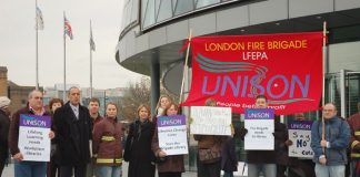London fire service staff outside City Hall yesterday to demand the withdrawal of threatened cuts