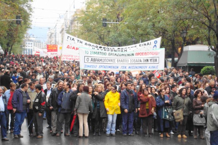 Greek workers stage another mass demonstration in Athens as the struggle against the right-wing Karamanlis government and paramilitary police force continues