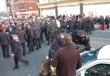 Police viciously launch into the large crowd of protesters against the Israeli bombing in Gaza outside the Israeli Embassy in London.  Ten pro-Palestinian demonstrators were arrested