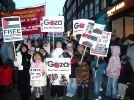 Workers Revolutionary Party and Young Socialists banner among marchers approaching the Israeli Embassy