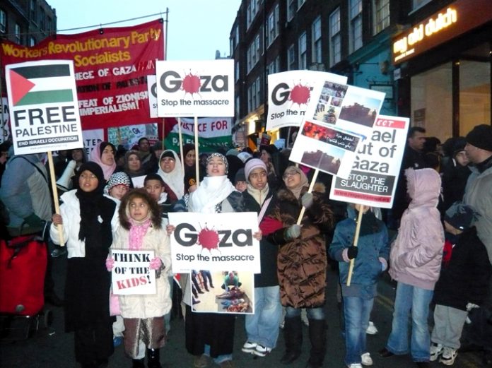 Workers Revolutionary Party and Young Socialists banner among marchers approaching the Israeli Embassy