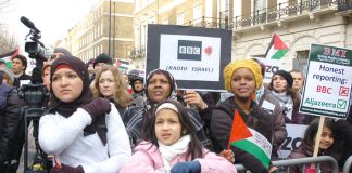 ‘BBC Radio Israel’, says a placard, during Saturday’s protest against the BBC refusal to broadcast an emergency aid appeal.