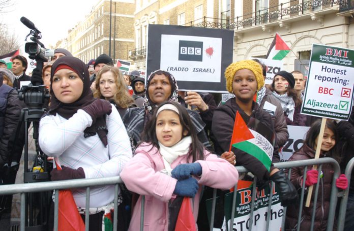 ‘BBC Radio Israel’, says a placard, during Saturday’s protest against the BBC refusal to broadcast an emergency aid appeal.