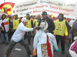 A Tamil marcher bashes an effigy of Sri Lankan President Rajapakse with his shoe – More than 120,000 Tamils and their supporters marched in London on Saturday to demand a halt to the shelling of Tamil areas in northern Sri Lanka and no more UK support for