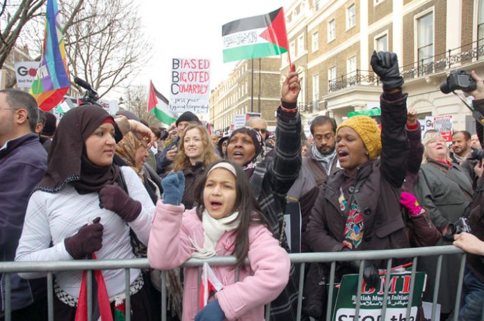 Demonstrators against the Israeli bombing of Gaza condemn the BBC for its refusal to broadcast an appeal for aid for Gaza