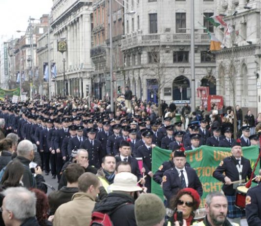 Fire officers and fire crews head the huge march down O’Connell Street