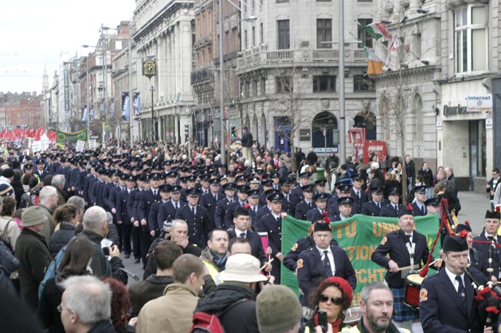 Fire officers and fire crews head the huge march down O’Connell Street