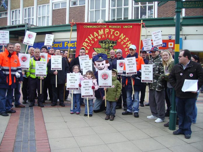 Northamptonshire postal workers demonstrating outside the surgery of Corby MP Phil Hope, after Hope reneged on a commitment to oppose the part-privatisation of the Royal Mail
