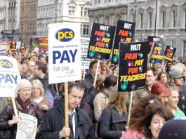 ‘IT IS WRONG TO PROFIT FROM THE SICK AND THE UNEMPLOYED’ says PCS Local government workers marching in London during the national pay strike of the NUT, PCS and UCU unions