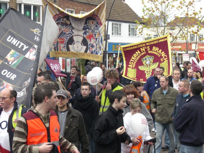 Postal workers in the UK marching in Milton Keynes to defend their Mail Centre