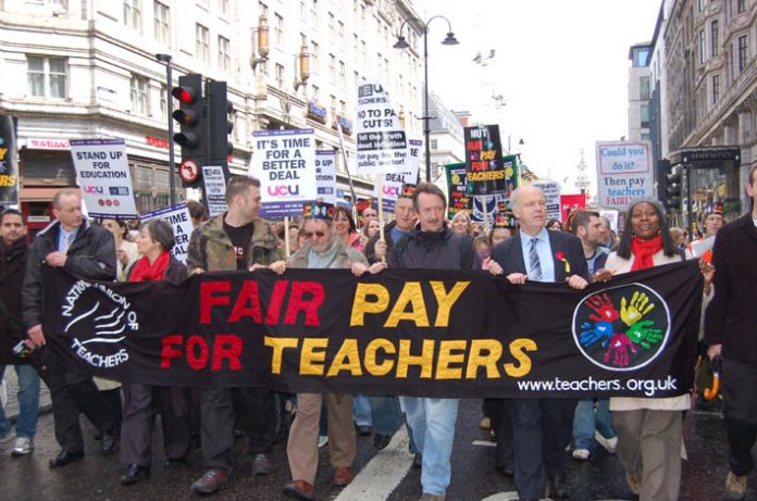 Teachers marching for fair pay during national strike action in April last year