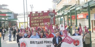Post workers  were applauded  as they marched through Corby town centre