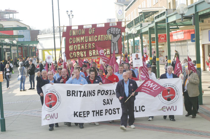 Post workers  were applauded  as they marched through Corby town centre