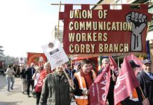 Royal Mail workers marching against privatisation that will mean mass sackings