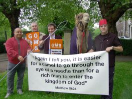 GMB members with a camel protest outside a church in Clapham against Damon Buffini, the head of the Permira venture capitalist group which owned the AA at the time