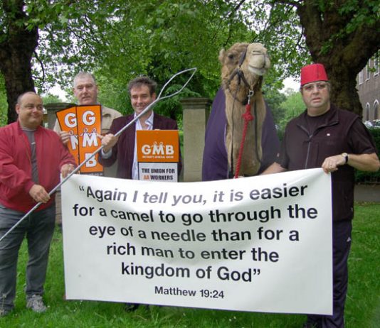 GMB members with a camel protest outside a church in Clapham against Damon Buffini, the head of the Permira venture capitalist group which owned the AA at the time