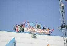 Workers occupying the roof of the Visteon factory in Enfield yesterday