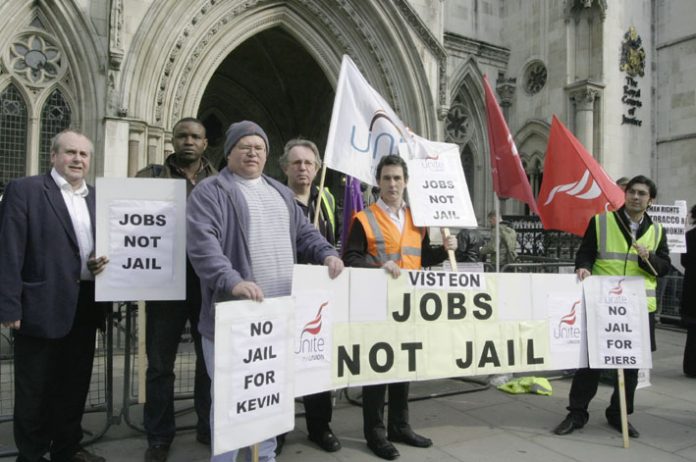 Unite members outside the High Court yesterday demonstrating for jobs and opposing the attempt to jail the leaders of the Enfield occupation