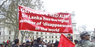 Tamils outside Parliament on Thursday condemn the Sri Lankan regime for its attacks on civilians