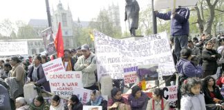 Tens of thousands joined a mass demonstration outside parliament yesterday demanding immediate action from the Brown government to stop the slaughter of Tamils by the Sri Lankan army