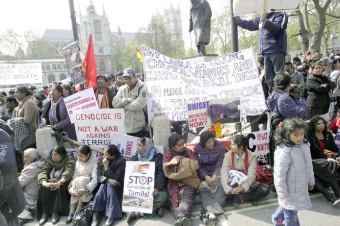 Tens of thousands joined a mass demonstration outside parliament yesterday demanding immediate action from the Brown government to stop the slaughter of Tamils by the Sri Lankan army