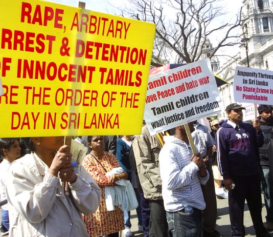 Tamils continuing their demonstration outside Parliament yesterday against the slaughter of Tamils by the Sri Lankan armed forces