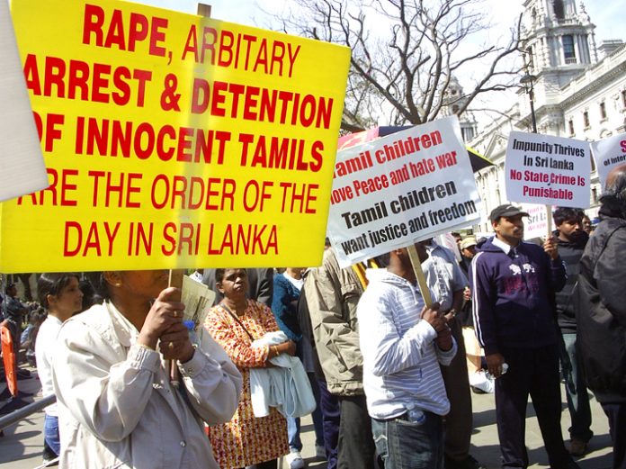 Tamils continuing their demonstration outside Parliament yesterday against the slaughter of Tamils by the Sri Lankan armed forces