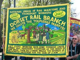 175th ANNIVERSARY OF THE GREAT DEMONSTRATION OF 1834 TO FREE THE TOLPUDDLE MARTYRS! – 100,000 marched from Copenhagen Fields The RMT Dorset branch banner pays tribute to the Tolpuddle Martyrs