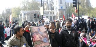 Tamils during a sit-down opposite parliament last week held pictures to bring home the genocide against their people