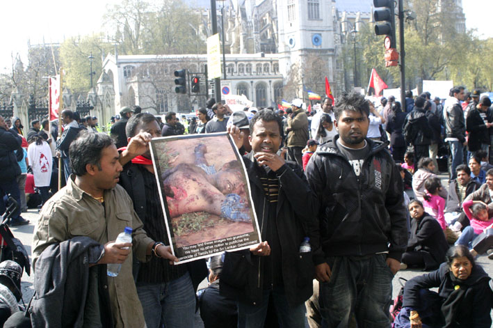 Tamils during a sit-down opposite parliament last week held pictures to bring home the genocide against their people