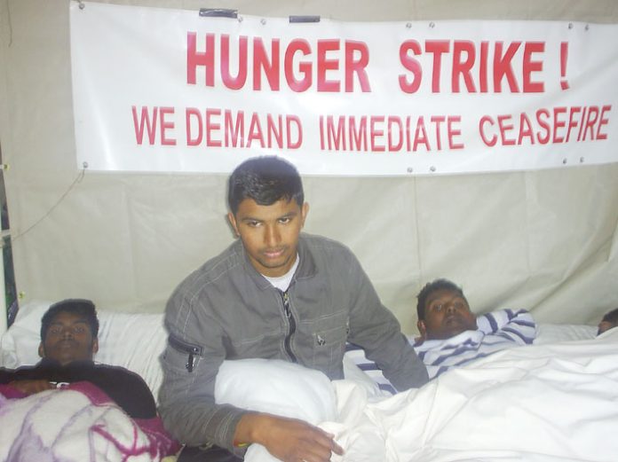Four young Tamils have joined the hunger strike outside Parliament demanding an immediate and permanent ceasefire to end the Sri Lankan Army genocide against the Tamil population