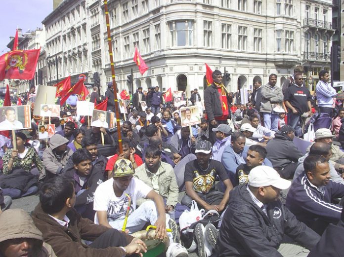 Tamils sat in the street outside Parliament to protest against the slaughter of 2000 civilians in 24 hours last week