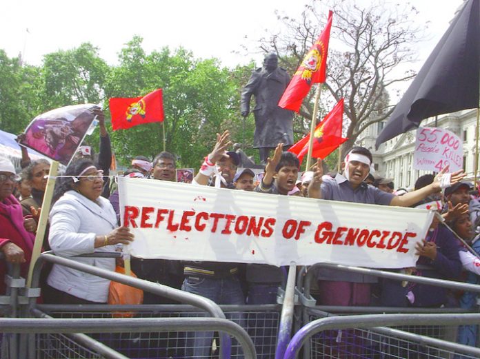 Protesters in Parliament Square against the genocidal attacks on Tamils