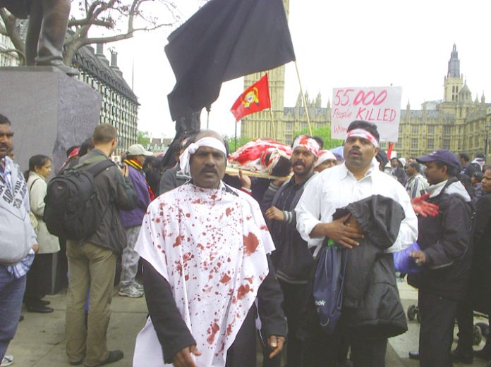 Tamil protesters in Parliament Square depict the Sri Lankan army atrocities against the Tamil people