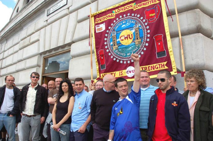 London postal workers along with MP Kate Hoey (right) demonstrated outside Royal Mail’s London headquarters yesterday